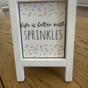 White Decorative Sign with Multicolor Sprinkles Design